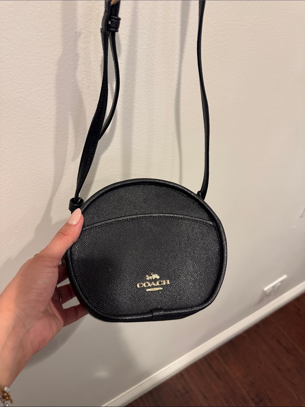 Coach Black Round Crossbody with Gold Logo